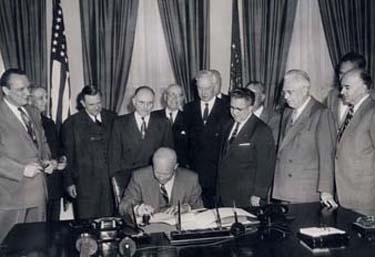 President Eisenhower signing H.R.8127
