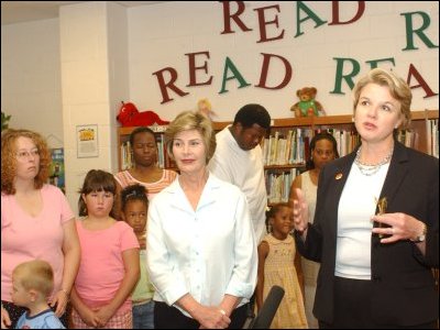 Laura Bush and Secretary Spellings, flanked by evaucuees of Hurricane Katrina, speak at a news conference at Greenbrook Elementary School in Southaven, Mississippi.