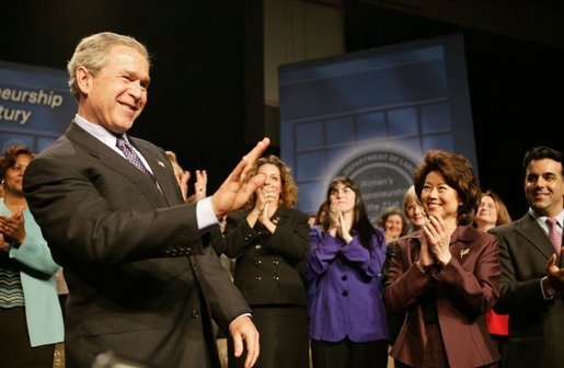 President George W. Bush reacts to the applause of the crowd before speaking at the Women's Entrepreneurship in the 21st Century Forum in Cleveland, Ohio, Wednesday, March 10, 2004. White House photo by Paul Morse