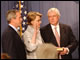 Margaret Spellings takes the oath of office, administered by White House Chief of Staff Andrew Card, as her family and President Bush look on.