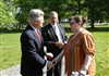 Priscilla Mason, widow of U.S. Marine Lance Cpl. Raymond C. Mason, who died May 28, 2006, as a result of complications from a wound he received during the Tet Offensive in 1968, shakes hands with James Nicholson, former secretary of Veterans Affairs, thanking him and Jan C. Scruggs, founder and president of the Vietnam Veterans Memorial Fund, for their help in getting her husband's name added to the memorial on May 7, 2008.