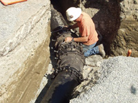 Contractor installing a water diversion pipe on Warren Creek in Humboldt County, Calif.