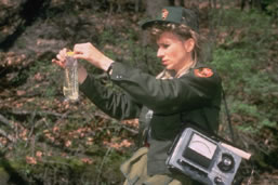 NPS Employee Collecting Water Sample