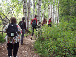 Participants in the Healthy Walk in the Woods program in Fairbanks, Alaska wind through a forested section of trail at Creamer's Field in August 2008. Photo Credit: Shannon Nelson/USFWS