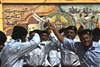 Kirkuk Provincial Police Academy cadets rejoice in their graduation with dance and cheers on May 15, 2008. The 400 graduates are the first former members of the Sons of Iraq, a citizens security group, to transition into the Iraqi Security Forces within the Kirkuk Province. 