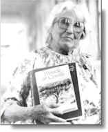 Betty Martin with her autobiography "Miracle at Carville"