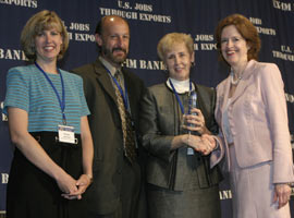 Export Insurance Services, Inc. (EIS)  President, Gail Wilson, pictured second from right, receives congratulations from Ex-Im Bank's Vice Chair April Foley after being named Small Business Regional Broker of the Year during the 2005 Small Business Awards Ceremony held at the Ex-Im Bank's annual conference in Washington, D.C.  EIS, an Augusta, Georgia family-owned business  and Ex-Im Bank partner since the 1980s, is a strong promoter of the Bank's Small Business Insurance products in the Southeast and, increasingly, other parts of the country such as the Chicago area.  Also pictured at the ceremony is Wilson's daughter Angela Johnson, left, and son, Jack Wilson.