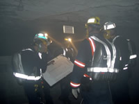 Mine rescue team training in smoke under apparatus