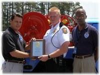 FLETC Presents GCFD Captain with Plaque