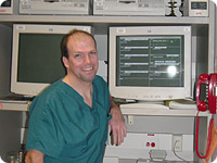 Picture of a nurse standing next to a computer
