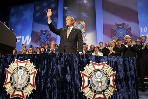 President George W. Bush reacts to the response of the audience before speaking to the Veterans of Foreign Wars convention in Cincinnati, Ohio, Monday, Aug. 16, 2004. White House photo by Paul Morse.