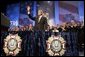 President George W. Bush reacts to the response of the audience before speaking to the Veterans of Foreign Wars convention in Cincinnati, Ohio, Monday, Aug. 16, 2004. White House photo by Paul Morse.