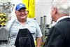 Defense Secretary Robert M. Gates meets with a worker at the Red River Army Depot's Bradley transmission and 25-millimiter gun production facility during a tour of the turret and final test section at in Texarkana, Texas, May 2, 2008.  