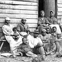 Group of 'contrabands' at Foller's house, Cumberland Landing, Va., 1862.