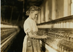 Portrait of a girl, standing, working at a machine in a textile plant, facing right, Cherryville, N.C.
