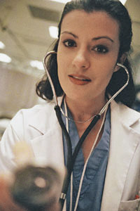 Female doctor checking a patient's heartbeat