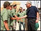 President George W. Bush shakes hands with American students from Connecticut, Massachusetts and California who are volunteering at Masada National Park in Masada, Israel. The President met the young men as he toured the historic site with Prime Minister Ehud Olmert, Mrs. Laura Bush and Mrs. Aliza Olmert. White House photo by Joyce N. Boghosian