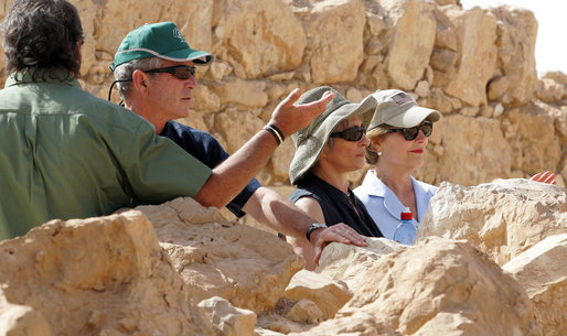 President George W. Bush and Mrs. Laura Bush stand with Mrs. Aliza Olmert, spouse of Israeli Prime Minister Ehud Olmert, as they listen to Eitan Campbell, Director of the Masada National Park, during a visit to the historic site Thursday, May 15, 2008, in Masada, Israel. White House photo by Joyce N. Boghosian