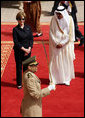 Mrs. Laura Bush and President Bush are greeted by Saudi delegation members during arrival ceremonies Friday, May 16, 2008, at Riyadh-King Khaled International Airport in Riyadh. White House photo by Shealah Craighead