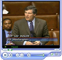 Video player icon of Rep. Inslee on the House floor speaking with one person in the background