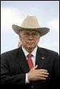 Vice President Dick Cheney stands with hand over heart for the playing of the national anthem, Wednesday, May 21, 2008, during the U.S. Coast Guard Academy commencement ceremony in New London, Conn. White House photo by David Bohrer