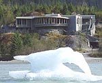 Mendenhall Glacier Visitor Center sits on a bluff overlooking Mendenhall Lake, where an interesting iceberg rests.