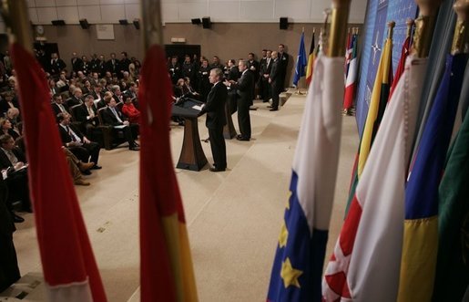 President George W. Bush and NATO Secretary General Jaap de Hoop Scheffer take questions during a news conference Tuesday, Feb. 22, 2005, at NATO Headquarters in Brussels. White House photo by Paul Morse