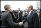 President George W. Bush shakes hands with Secretary General Jaap de Hoop Scheffer as he departs NATO headquarters in Brussels Tuesday, Feb. 22, 2005, at the conclusion of the NATO Summit. White House photo by Eric Draper