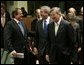 President George W. Bush laughs with Greek Prime Minister Costas Karamanlis, left, during a meeting at the European Union Council building in Brussels, Tuesday Feb. 22, 2005. White House photo by Eric Draper