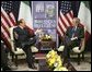 President George W. Bush meets with Prime Minister Silvio Berlusconi of Italy at NATO Headquarters in Brussels Tuesday, Feb. 22, 2005. White House photo by Eric Draper