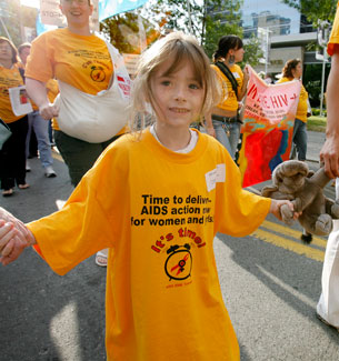 A girl walks as part of the First Annual National Women and Girl’s HIV/AIDS Awareness Day