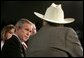 President George W. Bush listens to retired senior citizen Leo Keller during a Town Hall meeting about the strengthening of Social Security at the Montana ExpoPark in Great Falls, Mont., Thursday, Feb. 3, 2005. White House photo by Eric Draper