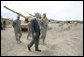 President George W. Bush talks with U.S. Army Captain Pat Armstrong during his visit to the U.S. Army National Training Center Wednesday, April 4, 2007, at Fort Irwin, Calif. White House photo by Eric Draper