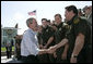 President George W. Bush shakes hands with agents after speaking Monday, April 9, 2007, at the new Yuma Border Patrol Station on comprehensive immigration reform. Speaking in the Arizona border city, the President told his audience, "We've got to resolve the status of millions of illegal immigrants already here in the country. So we're working closely with Republicans and Democrats to find a practical answer that lies between granting automatic citizenship to every illegal immigrant and deporting every illegal immigrant." White House photo by Eric Draper