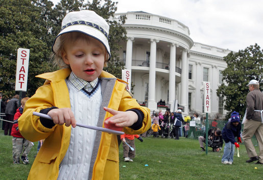 A little boy is careful not to drop his egg as he carries it through the Easter Egg Roll Monday, April 9, 2007, on the South Lawn during the 2007 White House Easter Egg Roll. White House photo by Joyce Boghosian