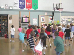 Photo: First- and second-graders in a Texas elementary school follow an exercise video.