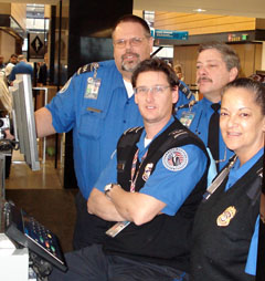Security officers from Phoenix helped SEA-TAC TSOs weather the storm. From left, are officers Erik Iversen, Frank Asencio, Peter Powers (seated) and Gina Garcia.