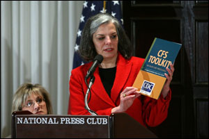 Photo: Julie Gerberding displays the CFS Toolkit