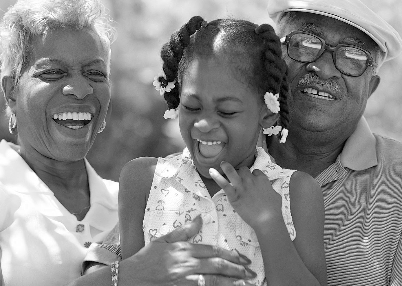 Photo of elderly man, woman and child