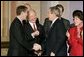 President George W. Bush talks with Senators Bill Frist, R-Tenn., right and Joe Lieberman, D-Conn., during the signing ceremony of S. 2845, The Intelligence Reform and Terrorism Prevention Act of 2004, in Washington, D.C., Dec. 17, 2004. White House photo by Paul Morse