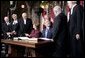 President George W. Bush and Laura Bush greet Parliament officials and sign guest books in the rotunda of Parliament Hill in Ottawa, Canada, Nov. 30, 2004.White House photo by Paul Morse