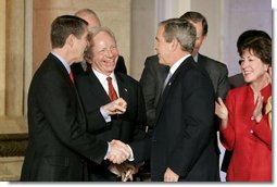 President George W. Bush talks with Senators Bill Frist, R-Tenn., right and Joe Lieberman, D-Conn., during the signing ceremony of S. 2845, The Intelligence Reform and Terrorism Prevention Act of 2004, in Washington, D.C., Dec. 17, 2004.  White House photo by Paul Morse