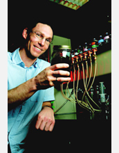 Photo of Daniel Bond holding Geobacter microbes.