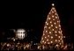 The National Christmas tree stands lit on the Ellipse in front of the White House Dec. 2, 2004. President George W. Bush and Laura Bush assisted Chantilly, Va., Girl Scout Brownies Clara Pitts and Nichole Mastracchio in lighting the 40-foot Colorado blue spruce. White House photo by Paul Morse.