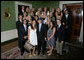 President George W. Bush stands with members of the University of California, Los Angeles Women's Water Polo 2007 Championship Team Monday, June 18, 2007 at the White House, during a photo opportunity with the 2006 and 2007 NCAA Sports Champions. White House photo by Eric Draper