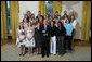 President George W. Bush stands with members of the University of North Carolina at Chapel Hill Women's Soccer 2007 Championship Team Monday, June 18, 2007 at the White House, during a photo opportunity with the 2006 and 2007 NCAA Sports Champions. White House photo by Eric Draper