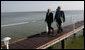 President George W. Bush and Polish President Lech Kaczynski walk along a dock Friday, June 8, 2007, at the Polish presidential seaside retreat in Jurata, Poland. White House photo by Eric Draper