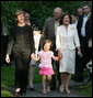 Mrs. Laura Bush walks with Maria Kaczynski, wife of Polish President Lech Kaczynski, and her granddaughter, Ewa, during a visit Friday, June 8, 2007, to the Polish presidential seaside retreat in Jurata, Poland. White House photo by Eric Draper