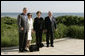 President George W. Bush and Mrs. Laura Bush join Polish President Lech Kaczynski and Maria Kaczynski, with their dog Titus, for a stroll Friday, June 8, 2007, at the Polish presidential seaside retreat in Jurata, Poland. White House photo by Eric Draper