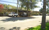 [photo]. Shows the front of the Shasta Lake Ranger Station. Select for a larger photo.